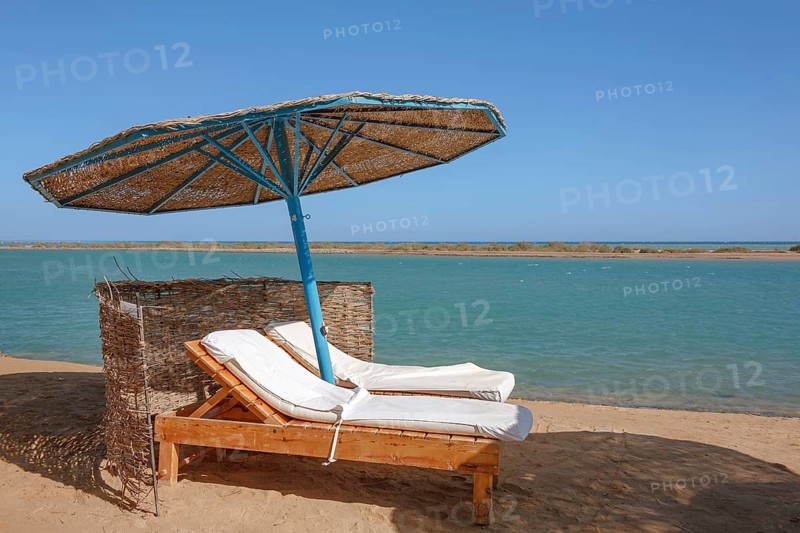 Parasol and sun loungers