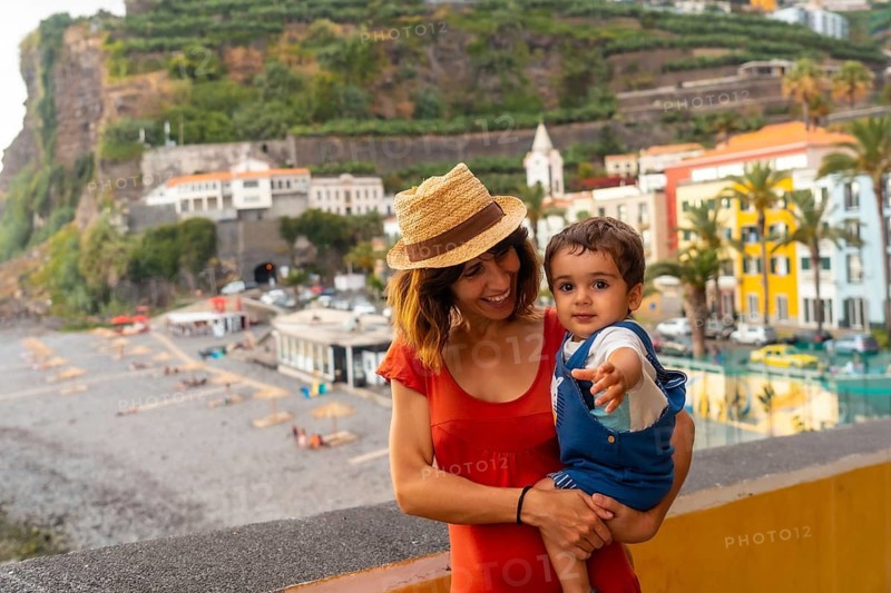 A mother and son on summer vacation at Ponta do Sol Beach