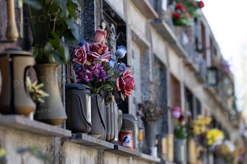 Wall with decorated urns graves in a cemetery in Sardinia