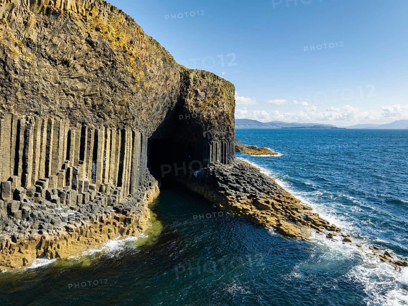 Aerial view of the uninhabited rocky island of Staffa with the prominent basalt columns and Fingal's Cave