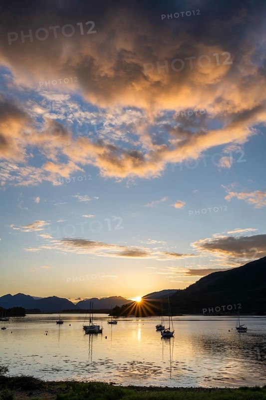 Sunset over the freshwater loch Loch Leven