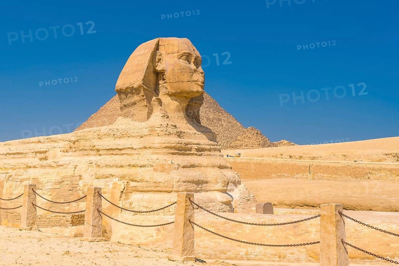 The Great Sphinx of Giza and in the background the Pyramids of Giza one summer afternoon