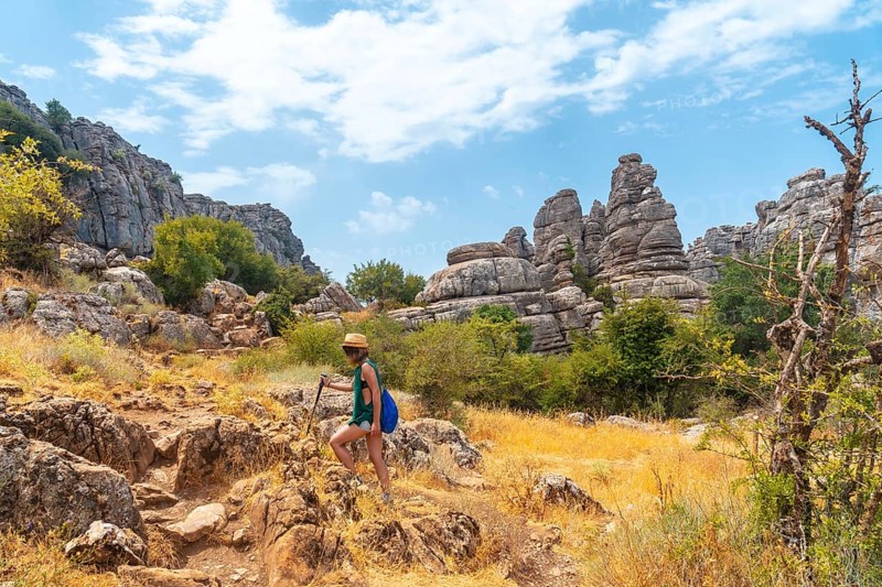 A young woman enjoying the Torcal de Antequera on the green and yellow trail