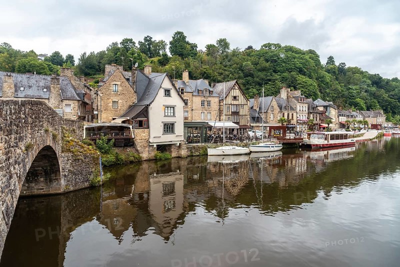 Houses and boats on the Rance river in Dinan medieval village in French Brittany