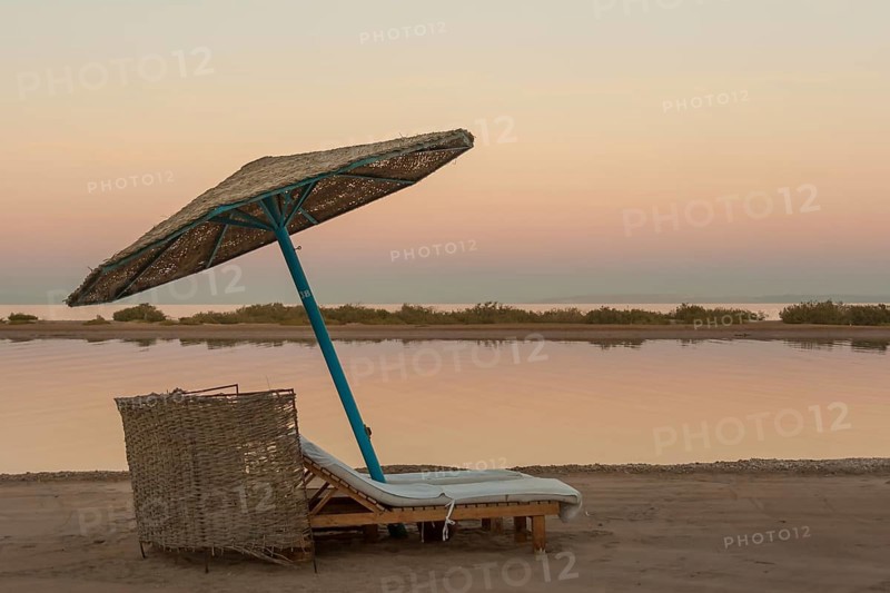 Parasol and sun loungers