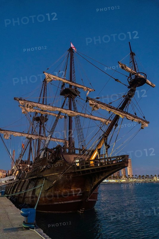 Old boat in the promenade of Muelle Uno in the Malagaport of the city of Malaga