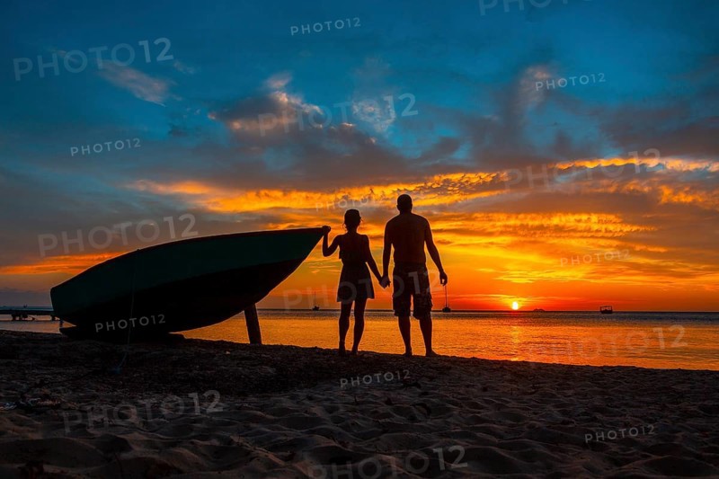 A couple in love at Roatan Sunset from West End. Honduras