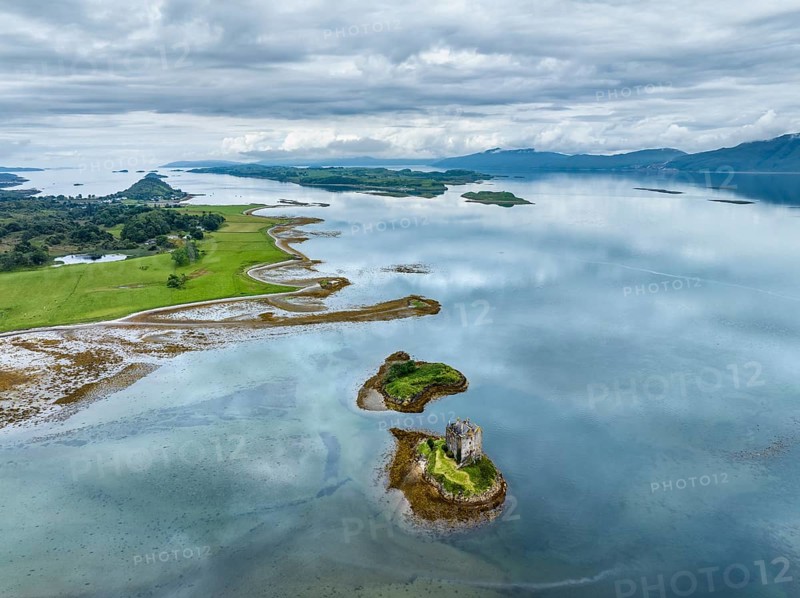 Aerial view of the 14th century island castle Castle Stalker in Loch Laich