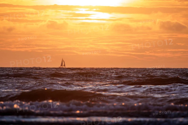 Sunset on the beach of De Panne