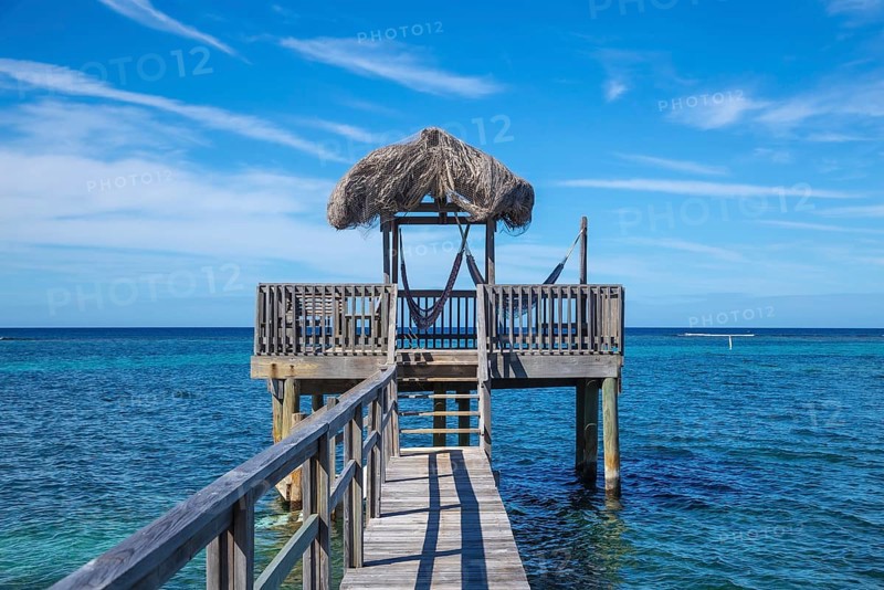 A small wooden house in the Caribbean Sea on Roatan Island. Honduras