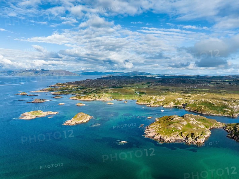 Aerial view of the coastline of the Ross of Mull peninsula with small islands