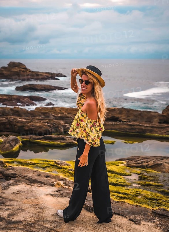 Caucasian blonde girl in a floral shirt