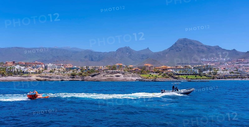 Tourists having fun on a boat on the Costa de Adeje in the south of Tenerife