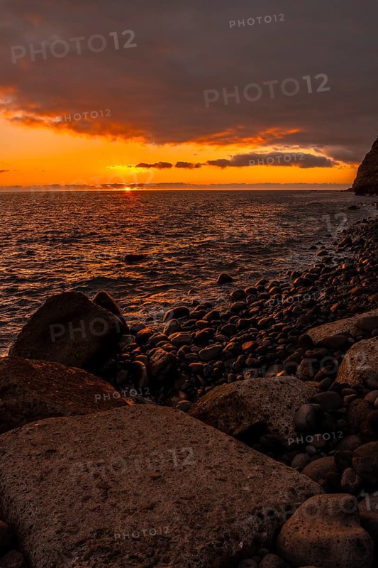 Orange sunset on the beach of Puerto de Tazacorte on the island of La Palma