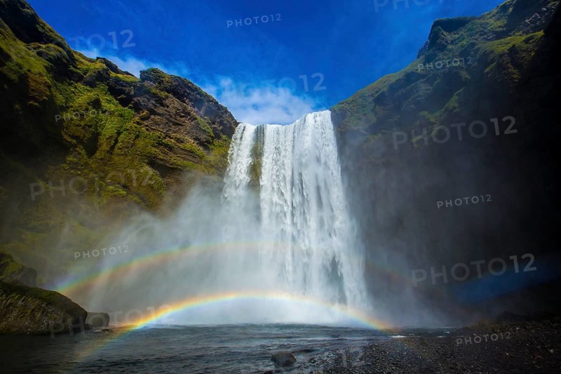 Rainbow at Skogafoss waterfall in the golden circle of south of Iceland