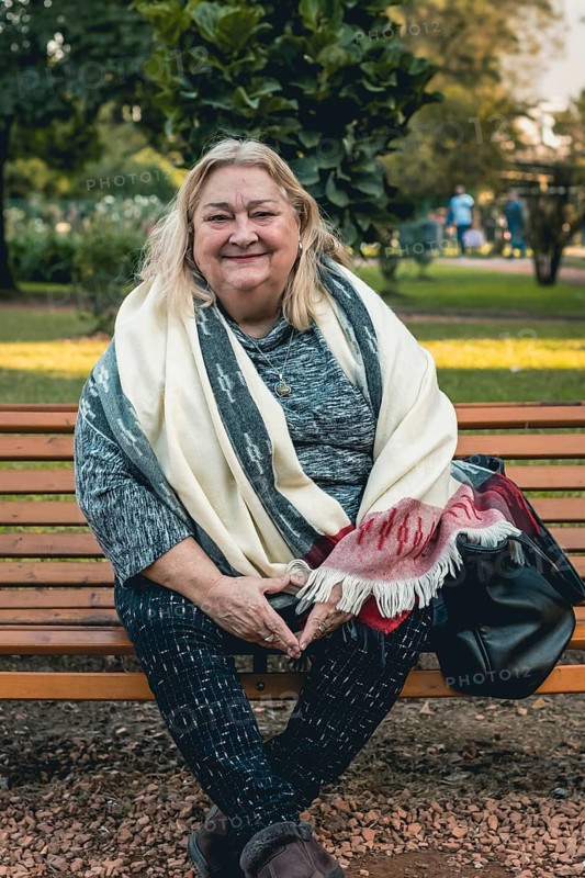 Portrait of a cheerful senior woman relaxing outdoors