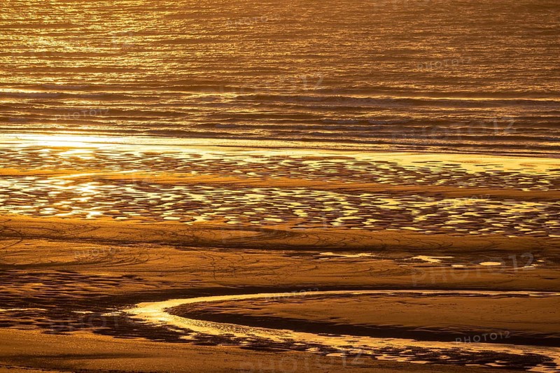 Sunset on the beach of De Panne