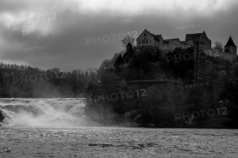 Rhine Falls and Swiss Flag with the Castle Laufen at Neuhausen in Schaffhausen