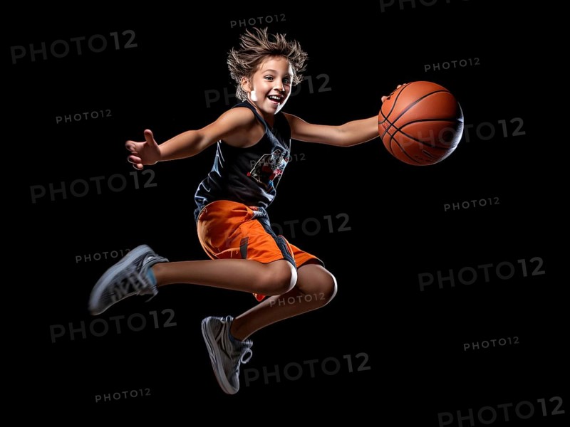 Young boy playing basketball