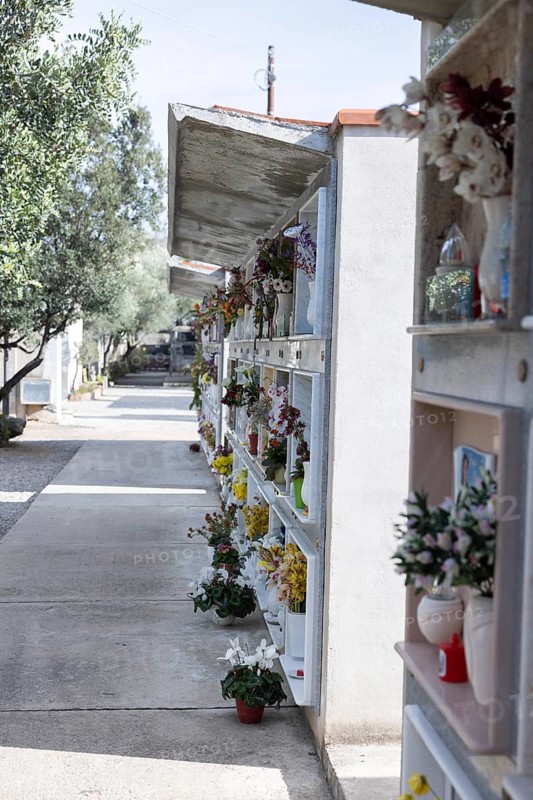 Wall with decorated urns graves in a cemetery in Sardinia