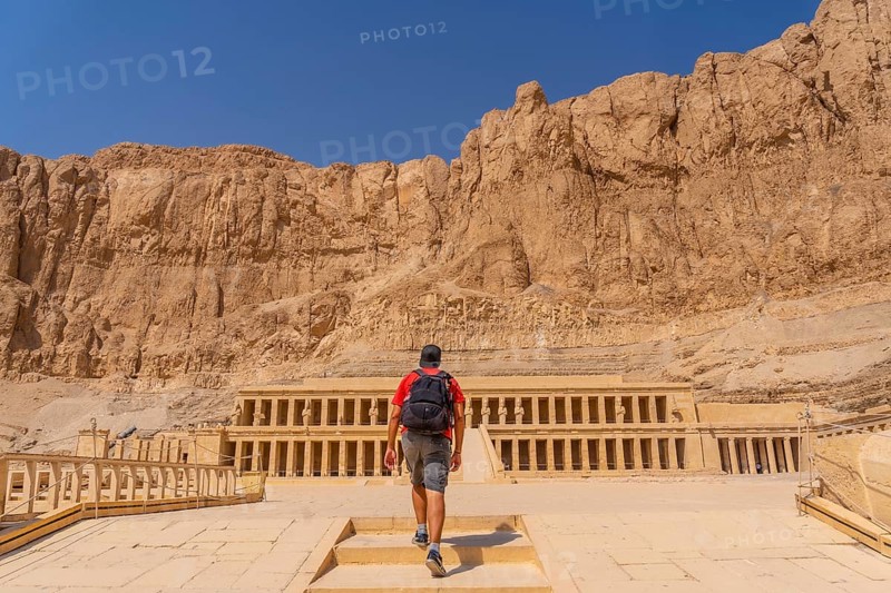 A young woman visiting the Mortuary Temple of Hatshepsut without people on her return from tourism in Luxor after the coronavirua pandemic