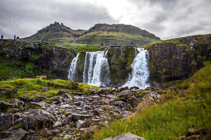 The famous Icelandic mountain Kirkjufell and the small waterfalls