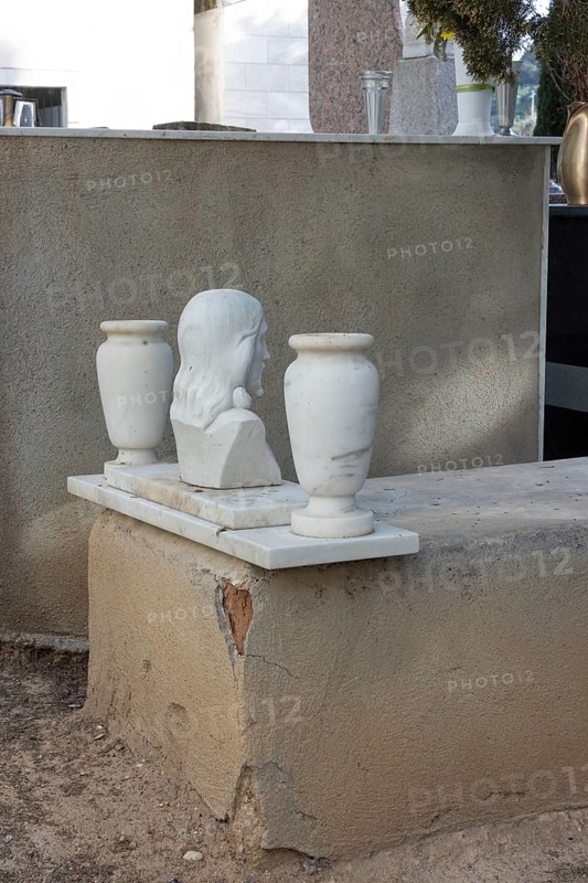 Simple grave with crumbling plaster