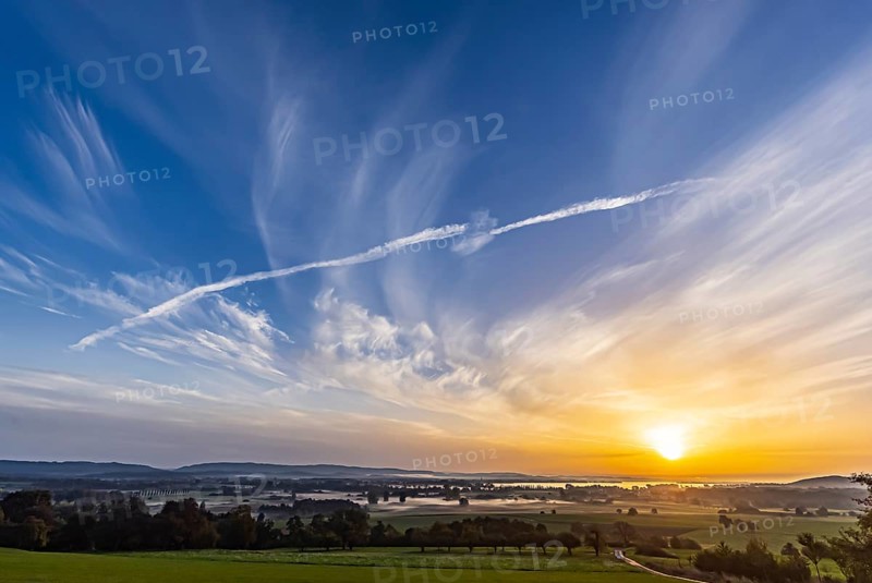 Sunrise at Lake Constance nature reserve Zeller Aachried with autumn fog