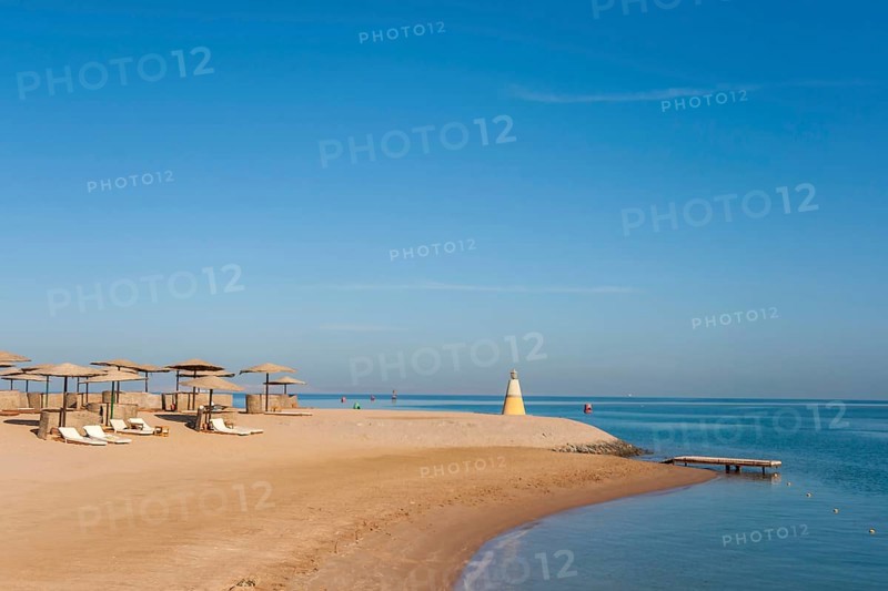 Parasol and sun loungers