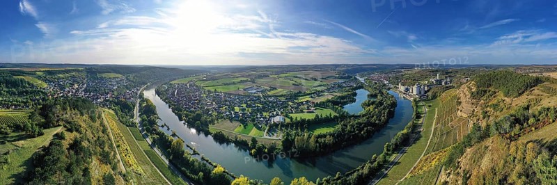 The river loop near Homburg am Main winds through the valley and is surrounded by trees and vineyards. Homburg