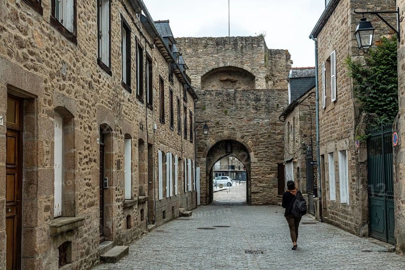 Lovely wooden houses in the old town of Dinan and its medieval castle along the Rance river in French Brittany