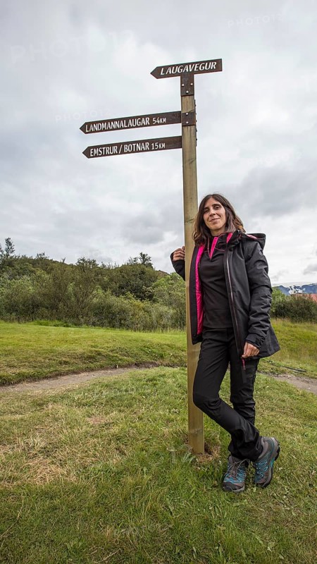 A young woman at the 54 km Thorsmoerk signal of the 4-day trek to Landmannalaugar. Iceland