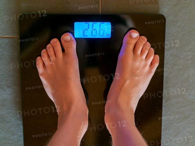 Children's feet on personal scale