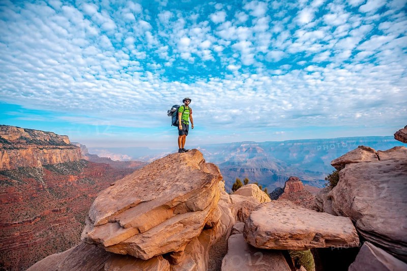 A young man on a viewpoint of the descent of the South Kaibab Trailhead. Grand Canyon