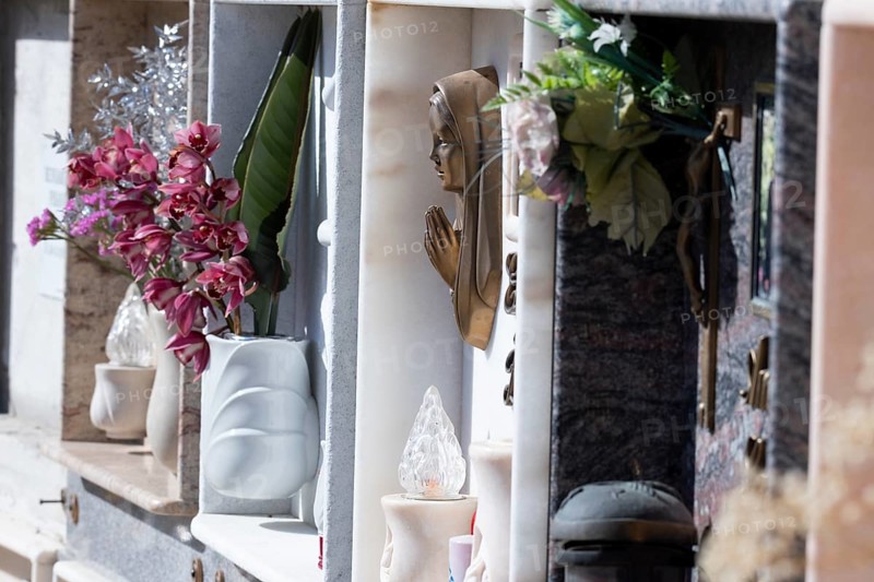 Wall with decorated urns graves in a cemetery in Sardinia