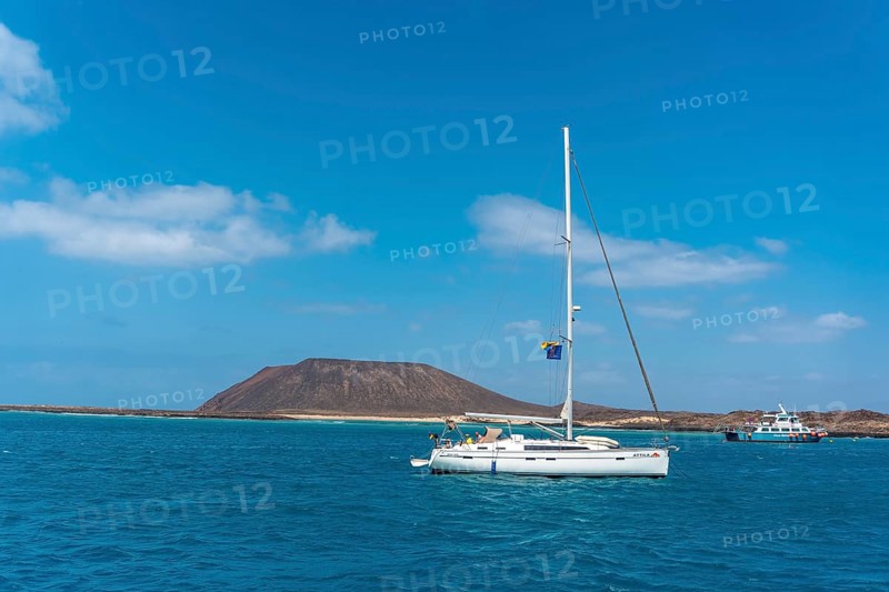 Boats in turquoise water on Isla de Lobos