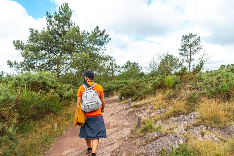 A young man on the footpath in the Broceliande forest