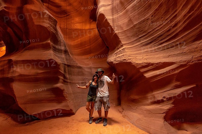 A couple admiring the beauty of the Upper Antelope Canyon in the town of Page