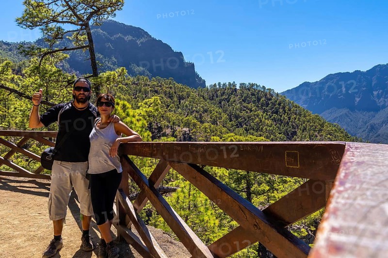 A tourist couple at the Mirador de los Roques on the La Cumbrecita mountain on the island of La Palma next to the Caldera de Taburiente