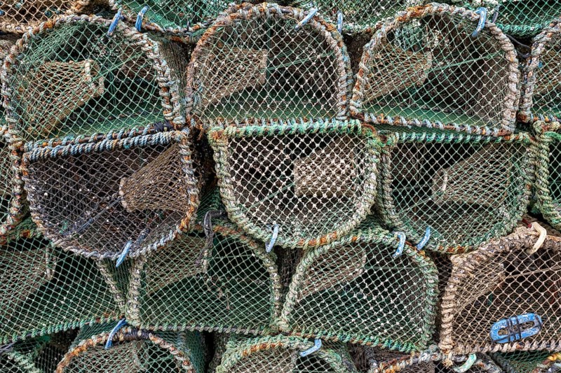 Lobster pots in the harbour of a coastal town