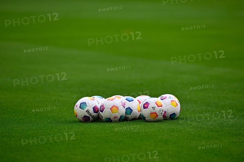Adidas Derbystar match balls lie on grass