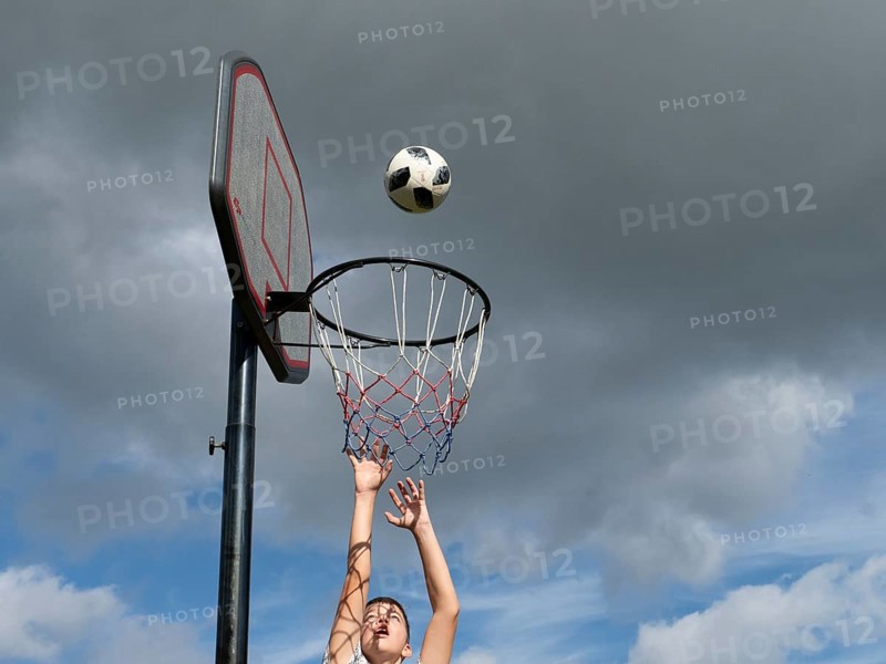 Basketball Jump with the ball to the basket and net