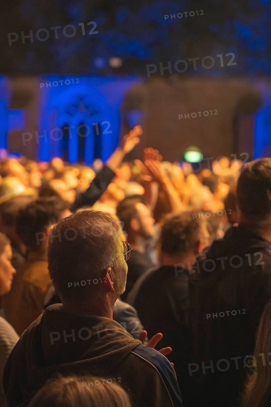Cheering crowd at Live Klostersommer Festival in Historic Monastery