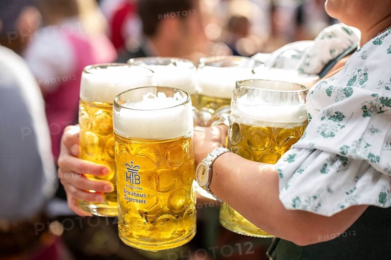 Waiter with beer mugs
