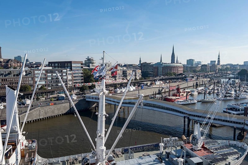 View of Niederhafen harbour and the museum ship Cap San Diego at the Ueberseebruecke bridge in the Port of Hamburg from a cruise ship