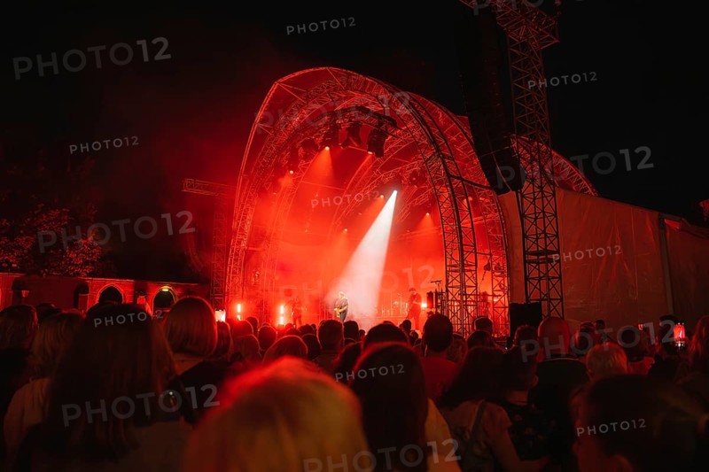 Crowd at Live Klostersommer Festival in Historic Monastery