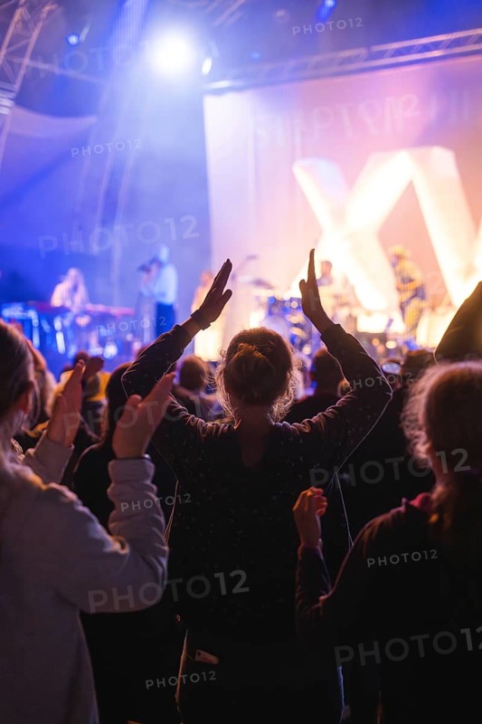 Cheering crowd at Live Klostersommer Festival in Historic Monastery