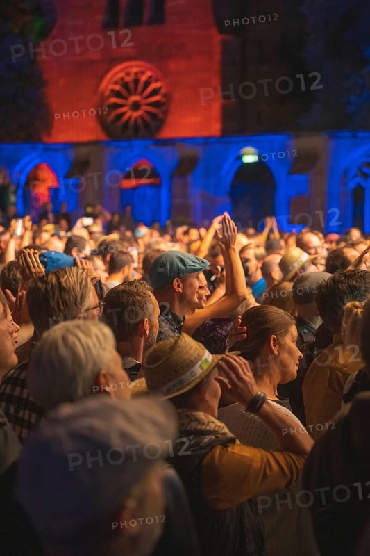 Cheering crowd at Live Klostersommer Festival in Historic Monastery