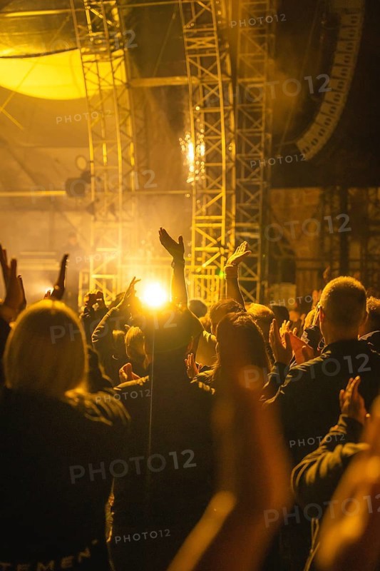 Cheering crowd at Live Klostersommer Festival in Historic Monastery