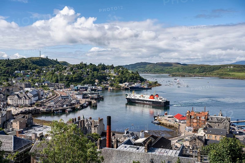 View over the harbour town of Oban to the ferry harbour with the ferry Isle of Lewis operating between Oban and Isle of Barra